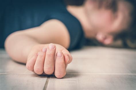 Dead Woman Lying On The White Floor Stock Photo - Download Image Now ...