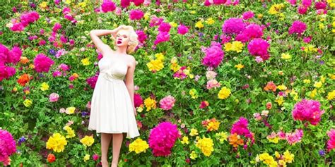 Marilyn Monroe posing in a flower garden near a | Stable Diffusion | OpenArt