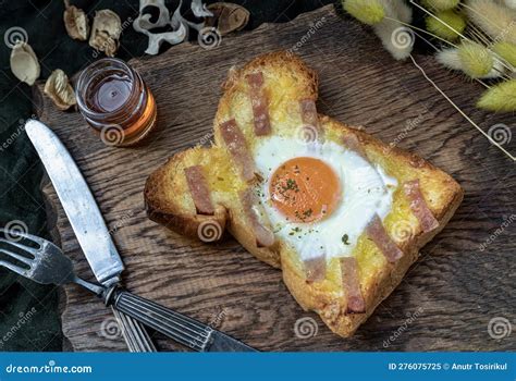 Homemade Fried Egg in a Hole Bacon and Cheese Toast Serve with Honey. Sandwiches for Breakfast ...