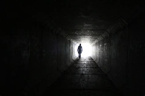 Person walking inside dark tunnel with white light on far distanc HD wallpaper | Wallpaper Flare