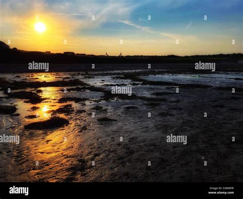 Sunrise on heysham beach Stock Photo - Alamy