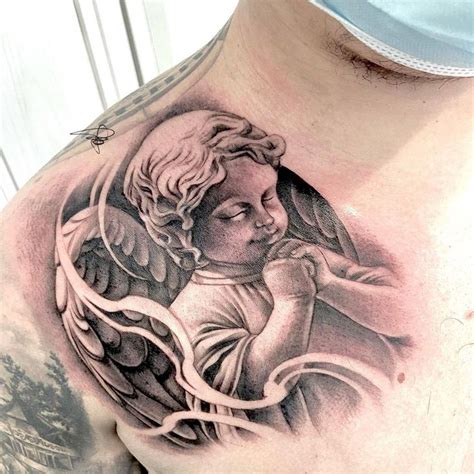 Shoulder Grace: Praying Baby Angel Tattoo - Serenity and Inspiration in ...