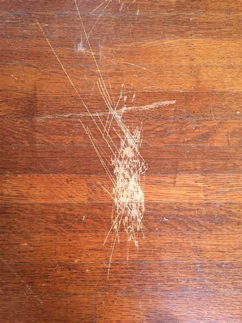 How can I fix these scratches on wood flooring? : r/howto