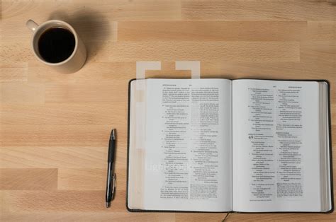 Coffee mug, pen, and open bible — Photo — Lightstock