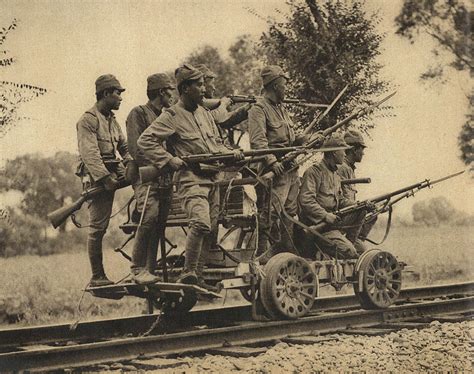 [Photo] Japanese Army soldiers with Arisaka Type 38 rifles on a hand cart, China, 1937; seen in ...