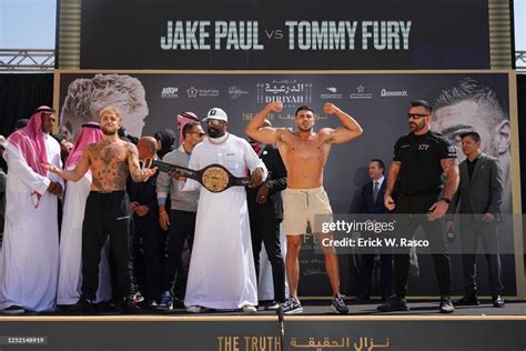 Tommy Fury and Jake Paul look on during the weigh-in on the eve of ...