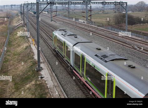 A London Midland train on the West Coast Mainline in the Midlands. Viewed from above Stock Photo ...