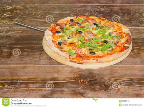 Pizza with Pizza Spatula on the Old Wooden Table Stock Photo - Image of cooking, herbs: 96662148