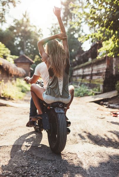 Couple enjoying motorcycle ride on village road – Jacob Lund ...