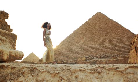 Ndoema in a goddess gold lame gown at the Giza Pyramids in Egypt. | THE ...