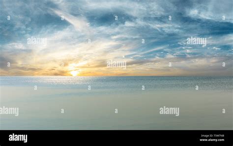 Calm river and sunset sky background Stock Photo - Alamy