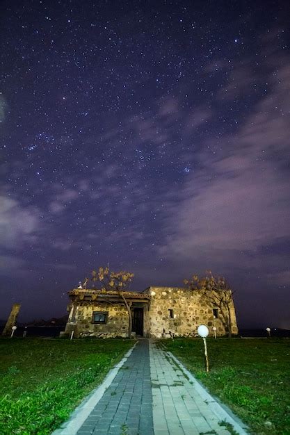 Premium Photo | A view of the stars of the milky way with a mountain top in the foreground ...