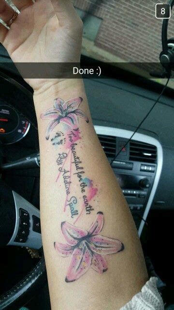 a woman's arm with a tattoo on it and the words done in pink ink