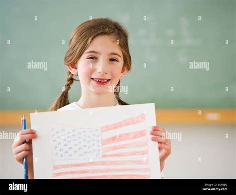 Child holding drawing of American flag Stock Photo - Alamy