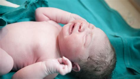 What Does It Mean If A Baby Doesn't Cry When They're Born? Experts Weigh In