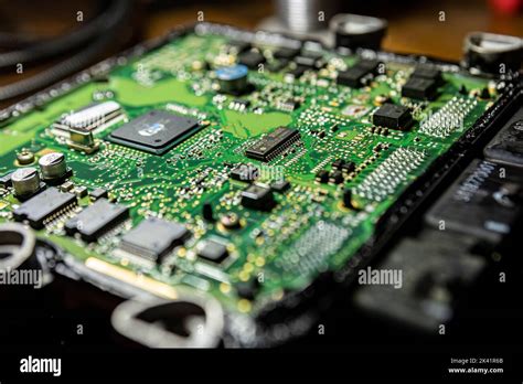 Car ecu repair detail. Electronic board repair Stock Photo - Alamy