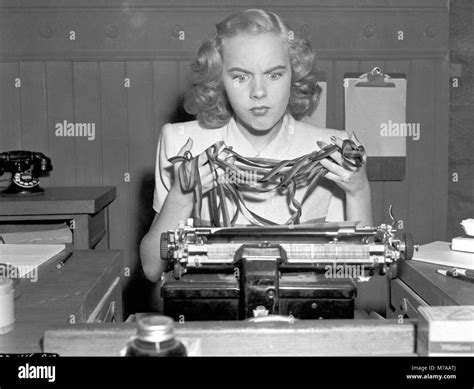 Woman, secretary, desperate on typewriter, knotted typewriter ribbon, 1940s, Germany Stock Photo ...