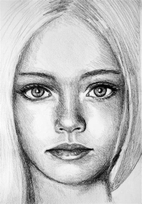 a pencil drawing of a woman's face with long blonde hair and blue eyes