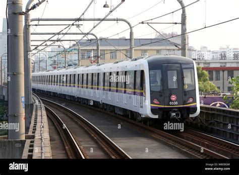 --FILE--A subway train of the Shanghai Metro Line 3 leaves a station in Shanghai, China, 31 July ...