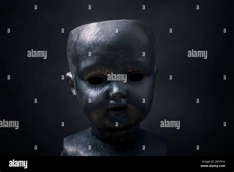 Creepy doll in the dark Stock Photo - Alamy