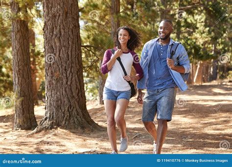 Couple on Hiking Adventure in Wooded Countryside Stock Photo - Image of ...