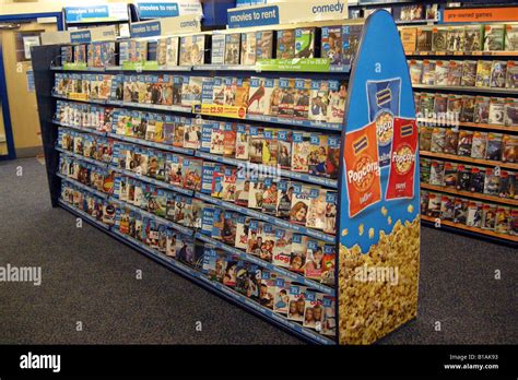 Shelf units for DVD moviess for rental inside a blockbuster store Stock Photo, Royalty Free ...