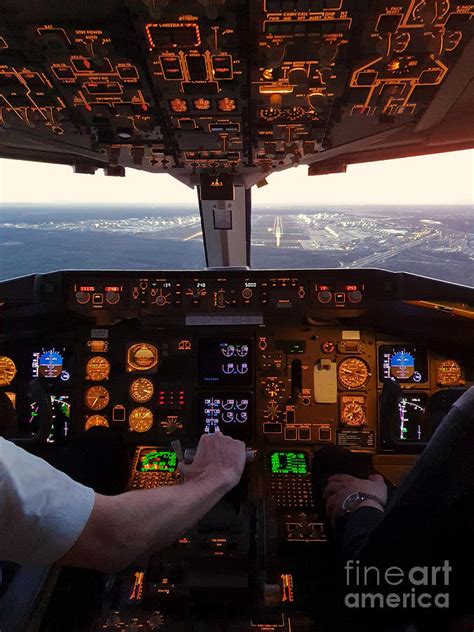 Cockpit view of commercial jet airplane landing on airport Photograph by Aviation Tees - Pixels