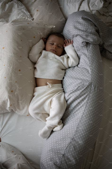 Cute infant sleeping on bed featuring asleep, growth, and young ...