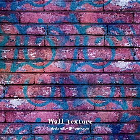 Brick wall texture with graffiti | Free Vector