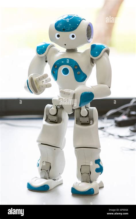 A small robot with human face and body - humanoid. Artificial ...