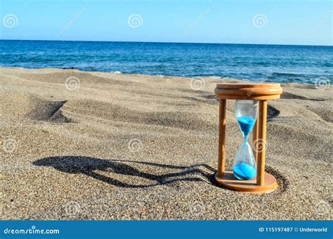 Hourglass Clock on the Sand Beach Stock Image - Image of summer, sand: 115197487