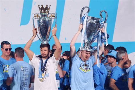 Man City celebrates winning treble of major trophies with open-top bus ...