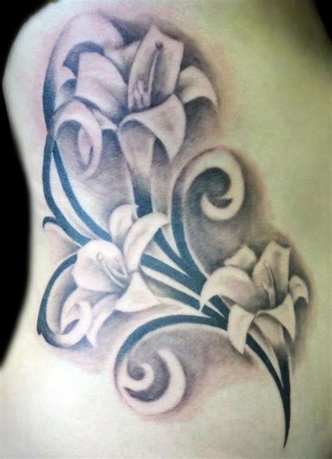 Easter lilies tattoos illustrated on her rib cage outstandingly with ...