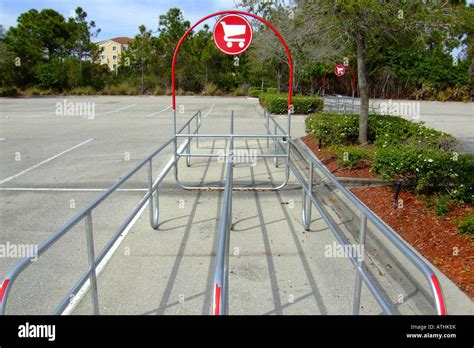 Shopping cart storage area in a shopping mall parking lot Stock Photo ...