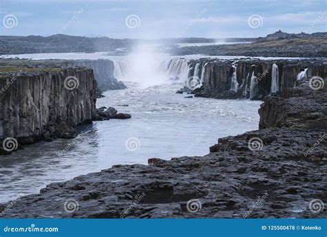 Cascade of Selfoss Waterfall in Iceland Stock Photo - Image of cloudy, awesome: 125500478