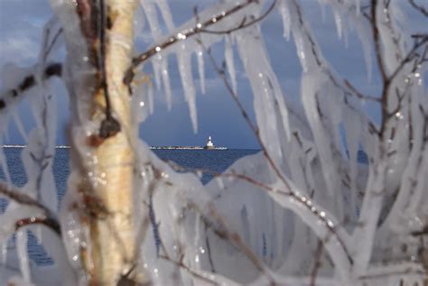 Lighthouse In Ice Photograph by Dave Poppe - Fine Art America