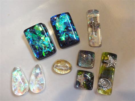 These are some of the epoxy resin pendants I made using cellophane glitter and nail polish ...