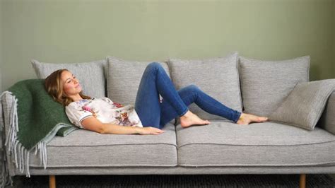 Woman Laying Down on Couch, Stock Footage | VideoHive