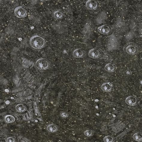 Premium Photo | Background puddle rain / circles and drops in a puddle, texture with bubbles in ...