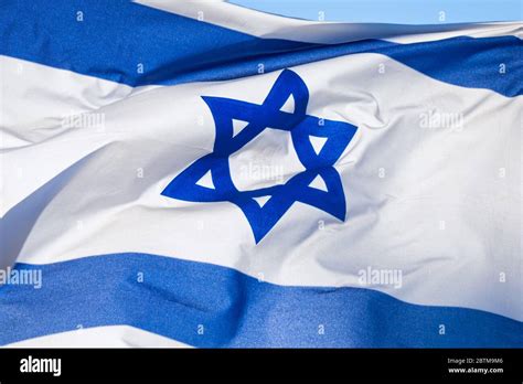 Flag of Israel, depicts a blue Star of David on a white background, between two horizontal blue ...