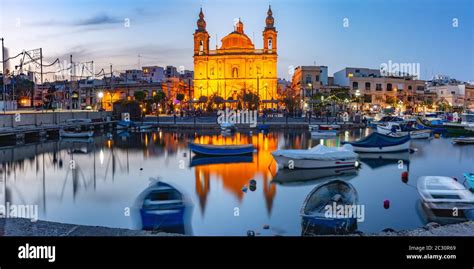 Panorama of Valletta harbour with yachts and fishing boats, Msida Parish Church of Saint Joseph ...