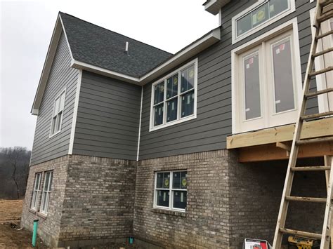 a house being built in the process of being remodeled with new windows ...