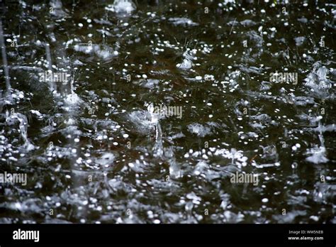 Photography of hitting hailstones in waters Stock Photo - Alamy