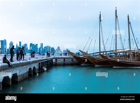 People at Doha Corniche at Doha Skyline in Background Stock Photo - Alamy