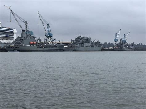 Three USN transport ships and an adorable stealth patrol boat in the Willamette River near ...