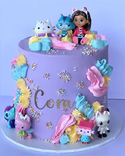 DDBAKES on Instagram: "This very cute Gabby Dollhouse theme cake went ...