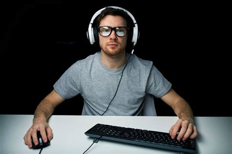 Man in Headset Playing Computer Video Game Stock Photo - Image of ...