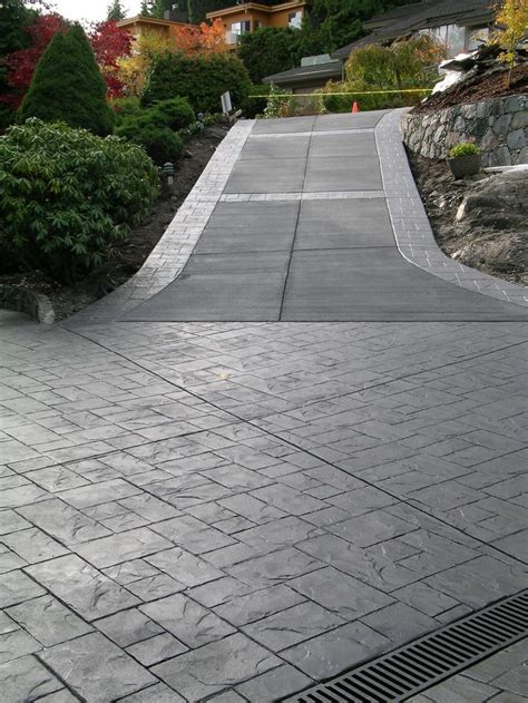 stained black concrete driveway - Google Search | Driveway design, Driveway landscaping ...