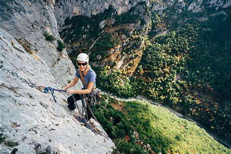 "Mountain Climber Summiting" by Stocksy Contributor "Juno" - Stocksy