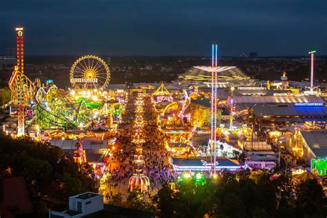 an amusement park at night with lights and rides